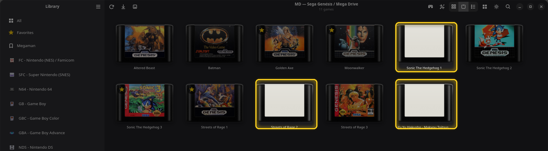 Une page Mega Drive où trois cartouches ont des étiquettes vierges, encadrées
